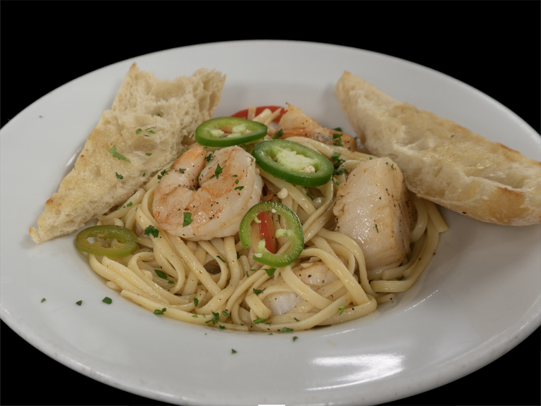 Tequila-lime shrimp and scallops over linguine at Char Restaurant. Photo: Char Restaurant