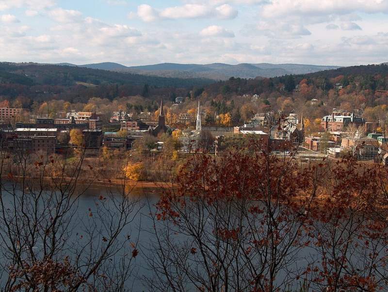 Brattleboro, Vermont in autumn with the Connecticut River in the foreground
